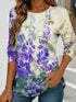 Women's blue floral watercolor print long-sleeved loose-fitting round neck top, casual, everyday, stylish and elegant.