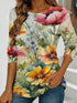 Women's blue floral watercolor print long-sleeved loose-fitting round neck top, casual, everyday, stylish and elegant.