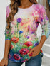 Women's blue floral watercolor print long-sleeved loose-fitting round neck top, casual, everyday, stylish and elegant.