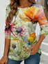 Women's blue floral watercolor print long-sleeved loose-fitting round neck top, casual, everyday, stylish and elegant.