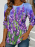 Women's blue floral watercolor print long-sleeved loose-fitting round neck top, casual, everyday, stylish and elegant.