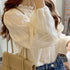 Elegant Apricot Long Sleeved Blouse with Lace Detail